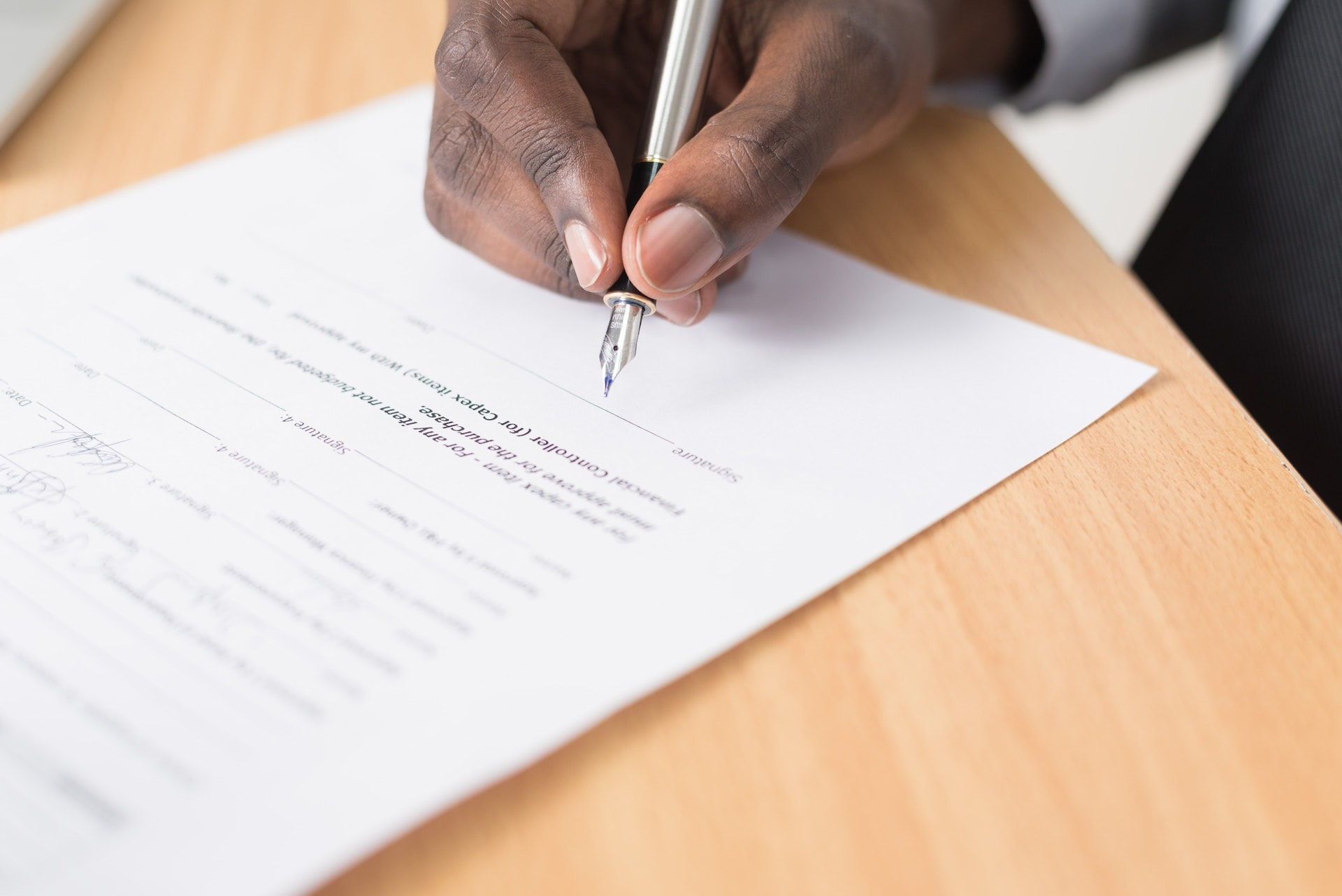 Signing a document on paper