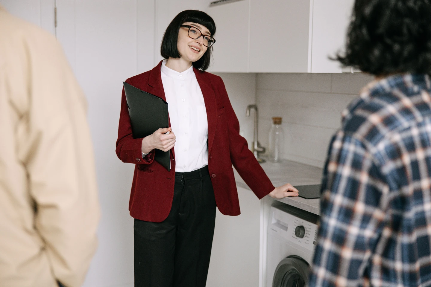 Homebuyers visiting a modern apartment with a real estate agent
