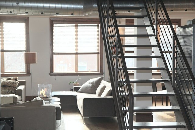 white living room with black stairs